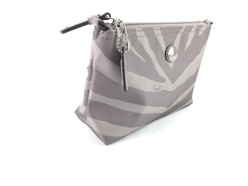 COACH CORNER ZIP WRISTLET IN SIGNATURE CANVAS WHITE/BLACK